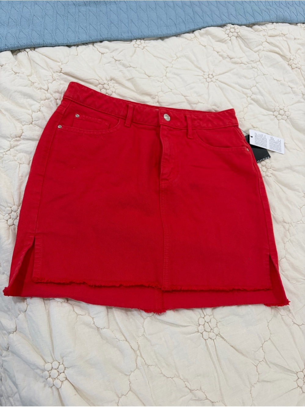 GUESS Vibrant Red Denim Mini Skirt with Raw Hem & Side Slits.